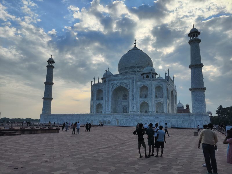 The Taj Mahal in Agra reflected in its garden pools in the early morning light