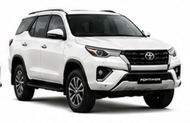 White Toyota Fortuner SUV available for hire with Oberoi Tours
